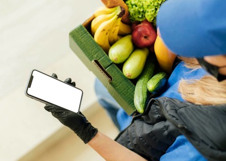 Close up woman holding food crate