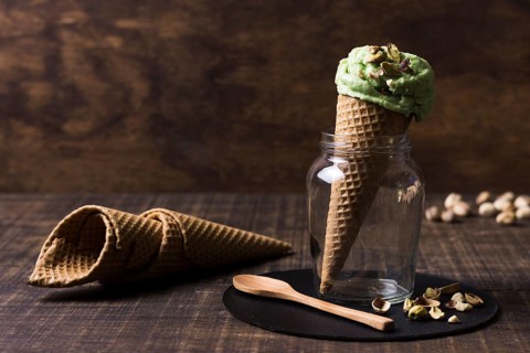 Delicious ice cream cones with pistachio