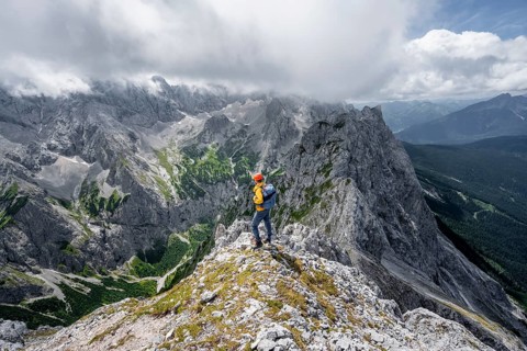 Mountaineer at the summit of the Waxenstein