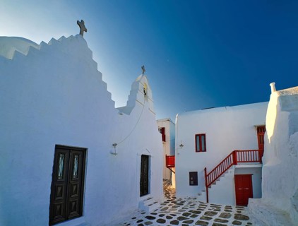 Famous tourist landmark of Greece. Entrance to Greek Orthodox Church of Panagia Paraportiani in Chora