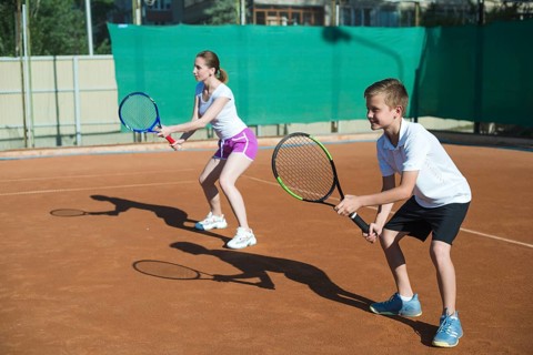 Woman kid playing tennis