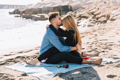 Amorous gentle couple embracing beach