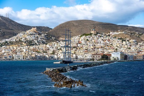 View of the town of Ermoupoli with harbour and large sailing ship