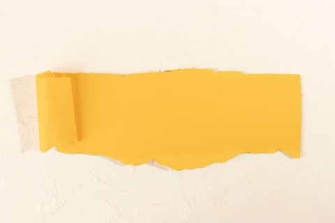 Crooked yellow strip paper pale rose background