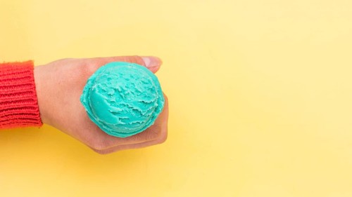 Crop hand holding ice cream