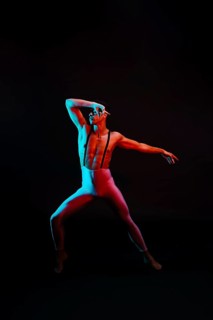 Male ballet dancer leotard with suspenders spotlight