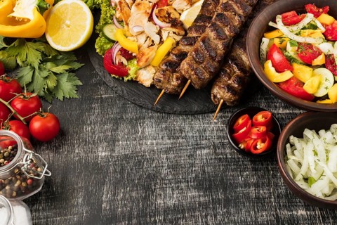 Top view tasty kebabs other dishes with ingredients