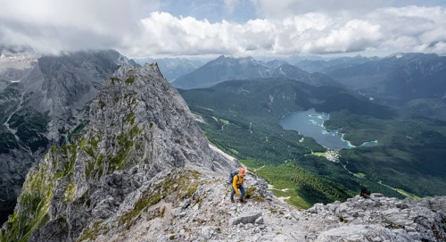 Mountaineer at the summit of the Waxenstein