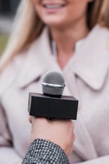 Close up journalist microphone
