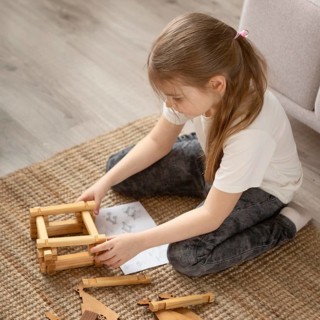 Full shot girl playing floor