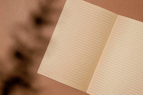 Top view open brown paper notebook