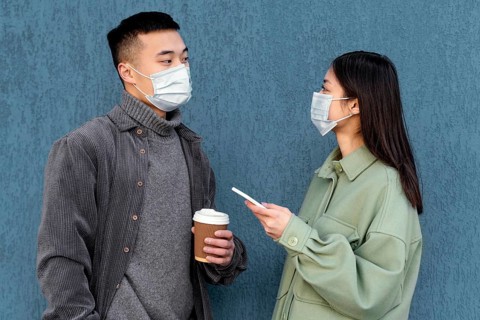 Young japanese couple wearing mask