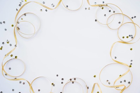 Decorative ribbon near colourful confetti