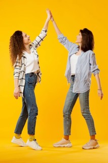 Front view friends giving high five