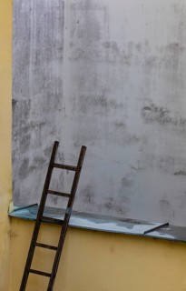 Stepladder leaning against a backyard facadein the historic old town of Ceske Budejovice