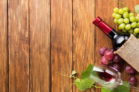 Wine with red green grapes frame
