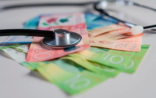 Stethoscope on Nicaraguan banknotes on white background. Stethoscope on Nicaraguan banknote isolated. Nicaraguan healthcare cost concept