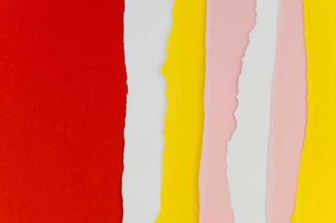 Red yellow vertical torn papers
