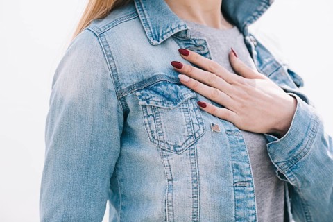 Woman with left hand chest