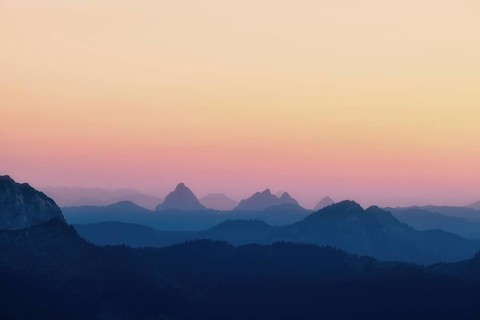 Hilly landscape with mountains Kleiner and Grosser Mythen after sunset