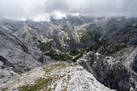 View from the summit of the Waxenstein over rocky and narrow ridge of the Waxenstein ridge to Hoellental with Jubilaeumsgrat