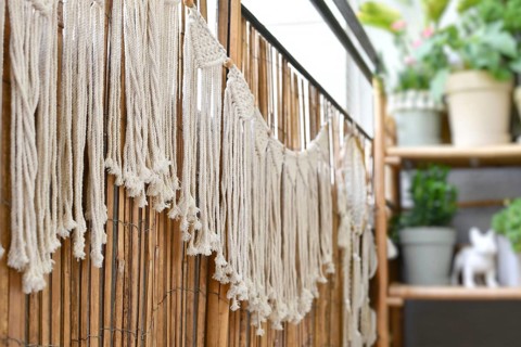 Makramee garland hanging on balcony reed screen