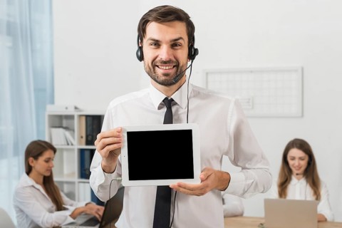Man call center showing tablet