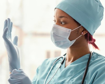 Close up health worker with gloves