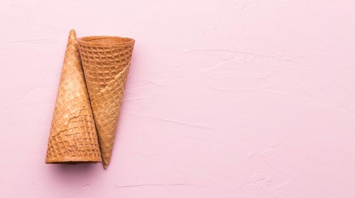 Empty waffle cones pink background