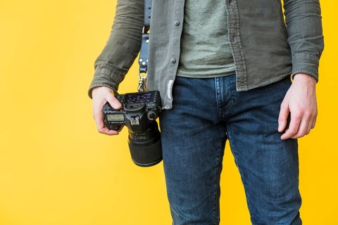 Grapher standing with camera