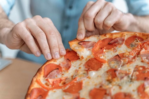 Businesspeople lunch break eating pizza close up