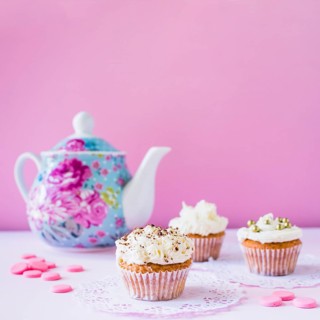 Cupcakes candies teapot white surface