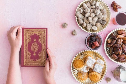 Hands with koran sweets