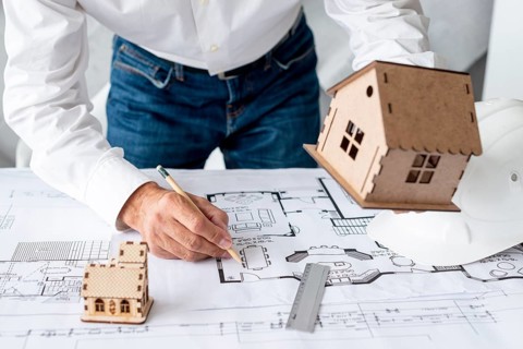 Architect showing miniature projects