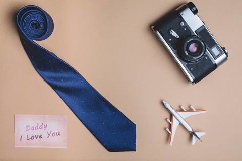 Background with necktie plane camera father s day