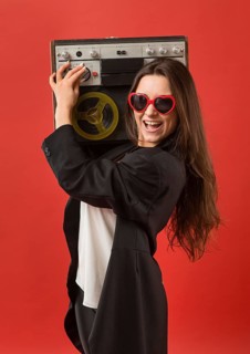 Woman party wearing sunglasses with radio