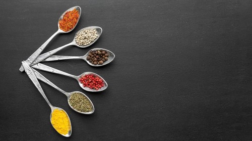 Copy space spoons with powder condiments