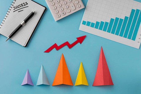 Top view business items with growth cones arrow
