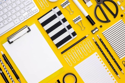 Flat lay office stationery with pencils keyboard