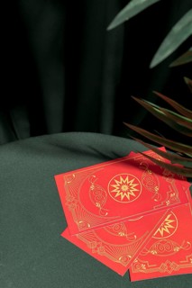 High angle red tarot cards table