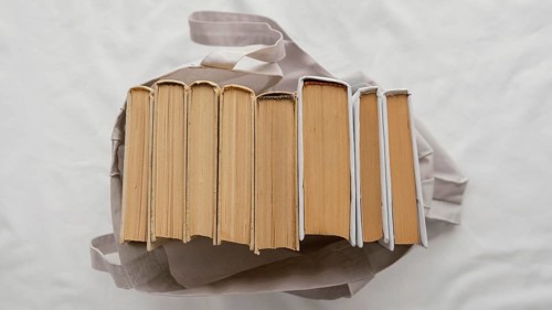 Top view books stack bag