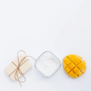 Flat lay cream soap mango with copy space