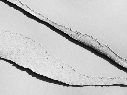 Gray torn paper layers