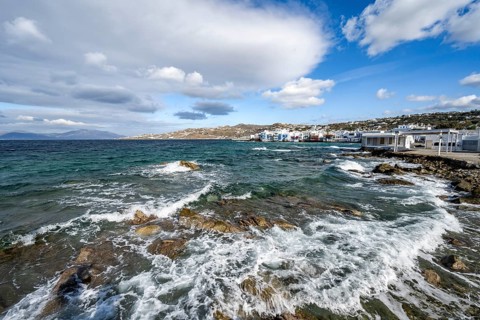 Waves breaking between the rocks on the beach