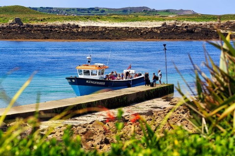 Tourist group on tour boat at jetty