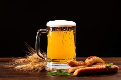 Close up beer mug with sausages