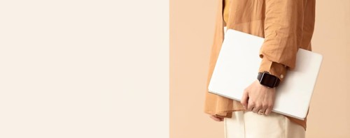 Person holding laptop protective case copy space