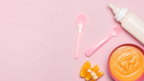 Top view baby food with baby bottle copy space