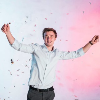 Boy posing with confetti new year party