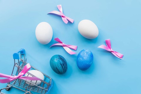 Colored eggs with ribbons cart